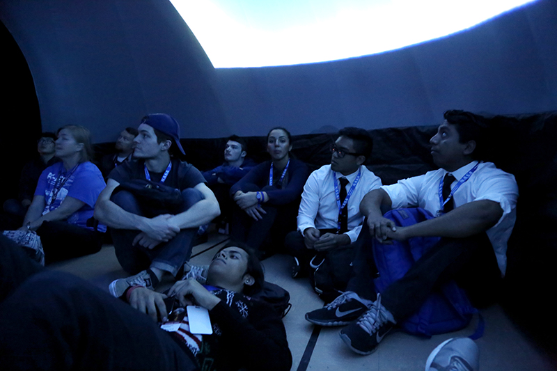 NCAS students watch a show in the inflatable planetarium