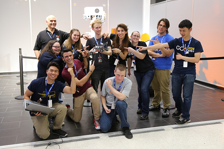 The Red Team poses for a group photo in front of the Mars Curiosity rover model at JPL