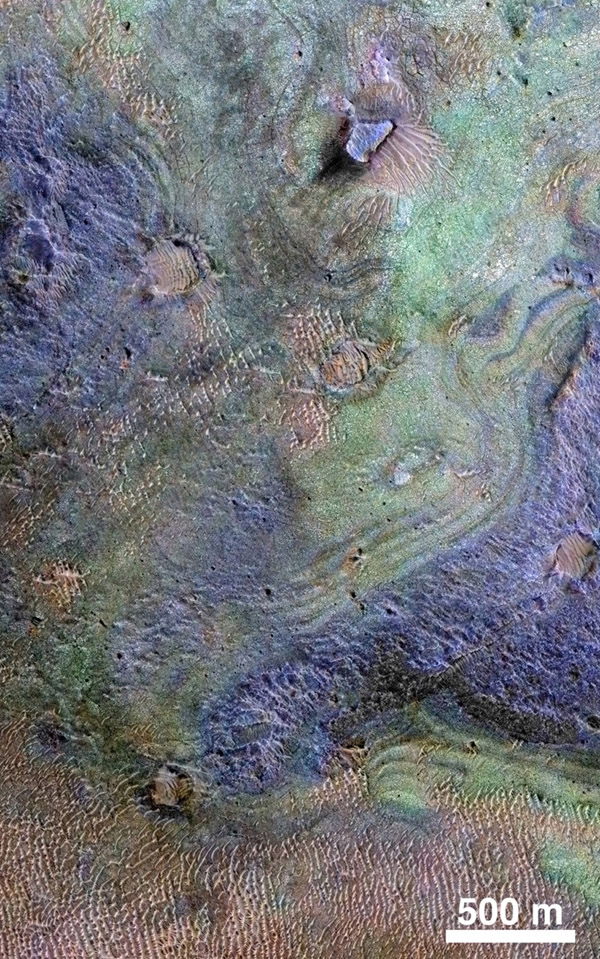 This view combines information from two instruments on a NASA Mars orbiter to map color-coded composition over the shape of the ground within the Nili Fossae plains region of Mars. Image credit: NASA/JPL-Caltech/JHUAPL/Univ. of Arizona