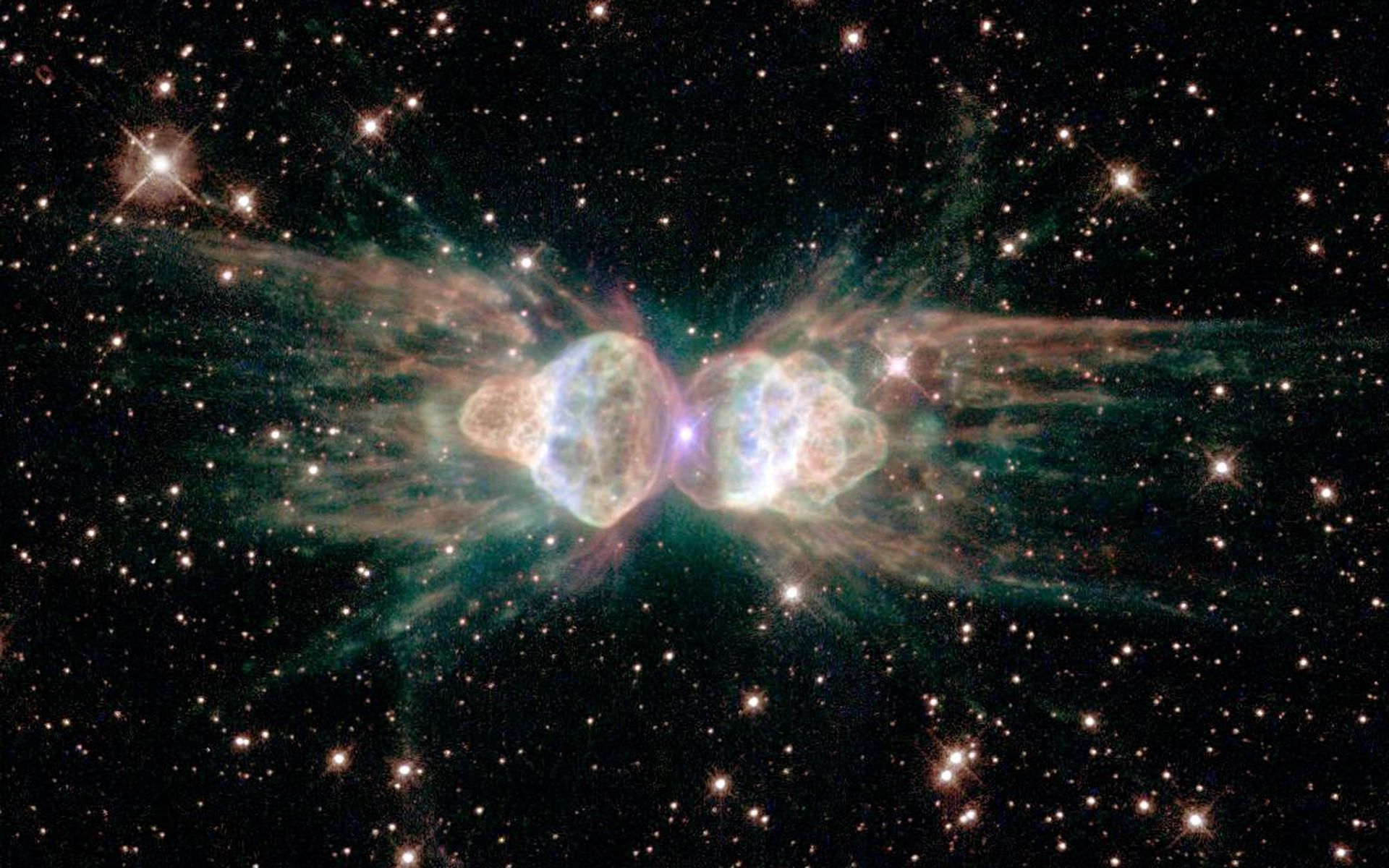 This Hubble image of the planetary nebula Mz3 looks like a pair of angels to me; more mundanely it's called the Ant Nebula...