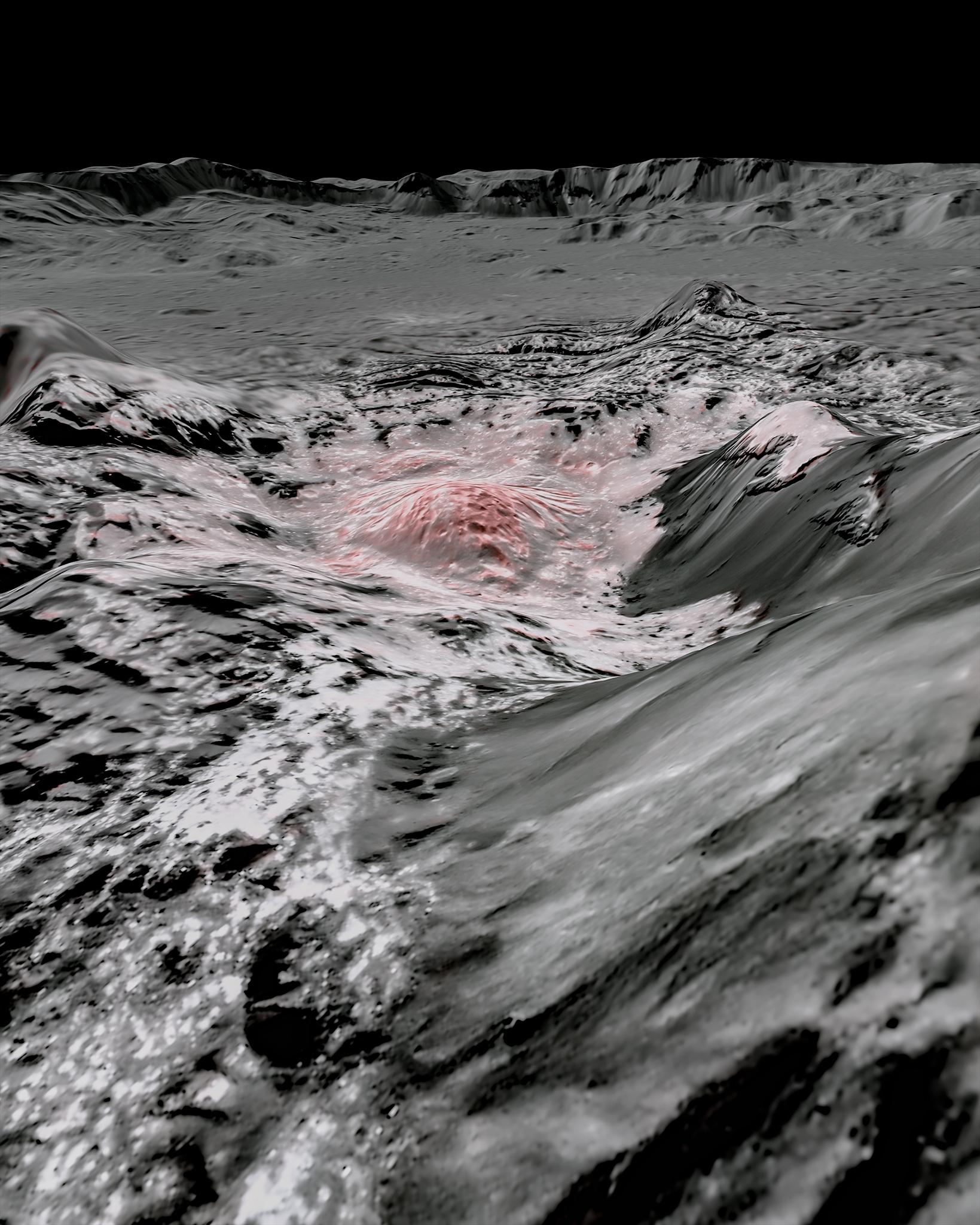 Steep hills in the basin of a crater are shown in black and white with a speckled trail of white leading to a white and pink mound at the center of the image.