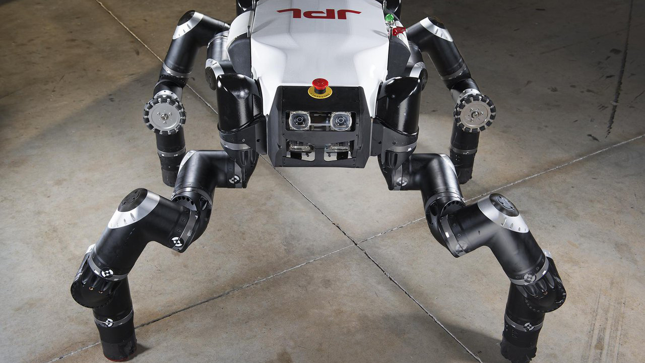 A robot with a torso-like body and four articulating legs