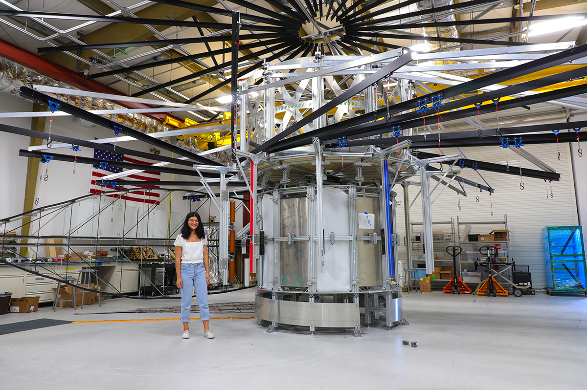 Allison Ayad stands under the support structure for a full-scale model of Starshade