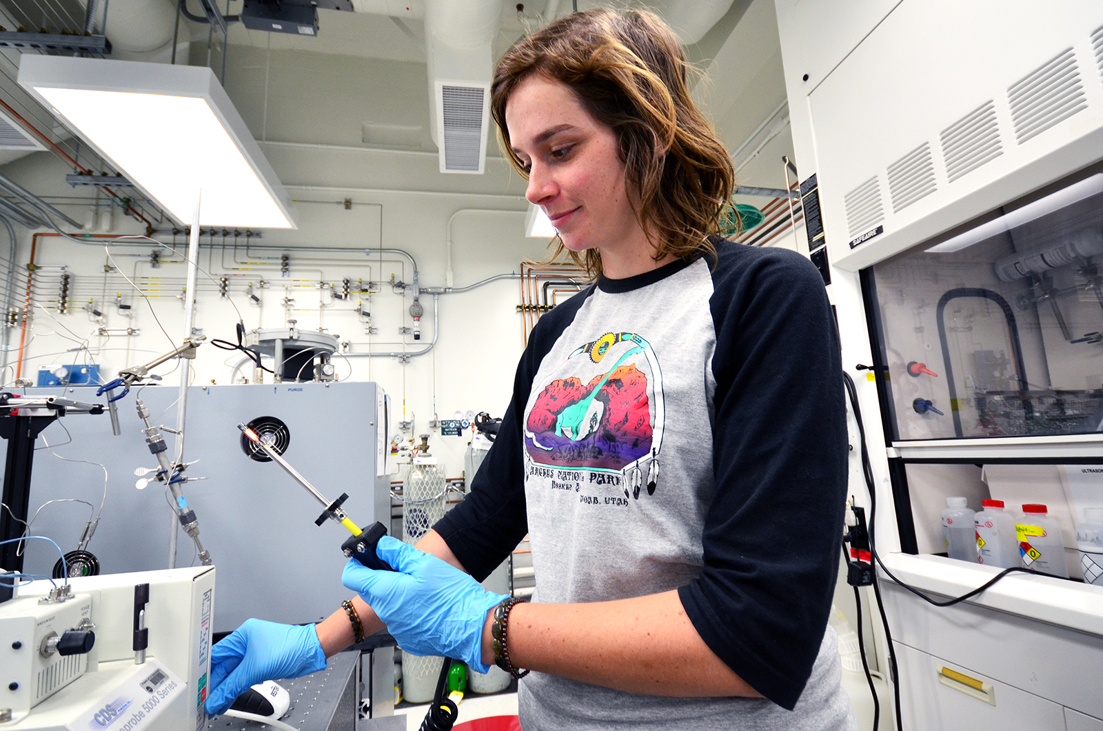 Amanda Allen shows the instrument she's working with this summer