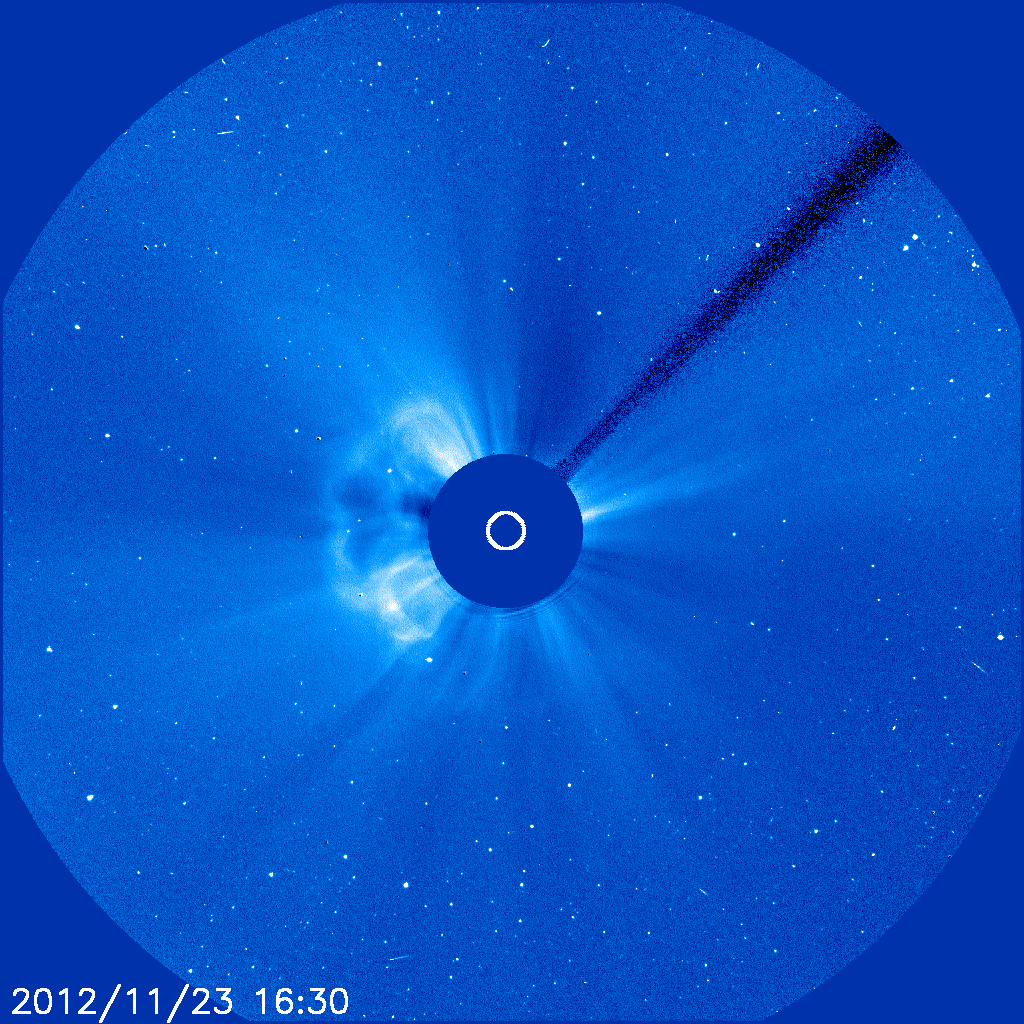 Wispy solar flares from the Sun can be seen jutting out from a solid central circle.