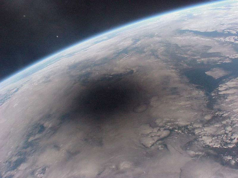 A satellite image of the Moon's shadow on Earth during a total solar eclipse