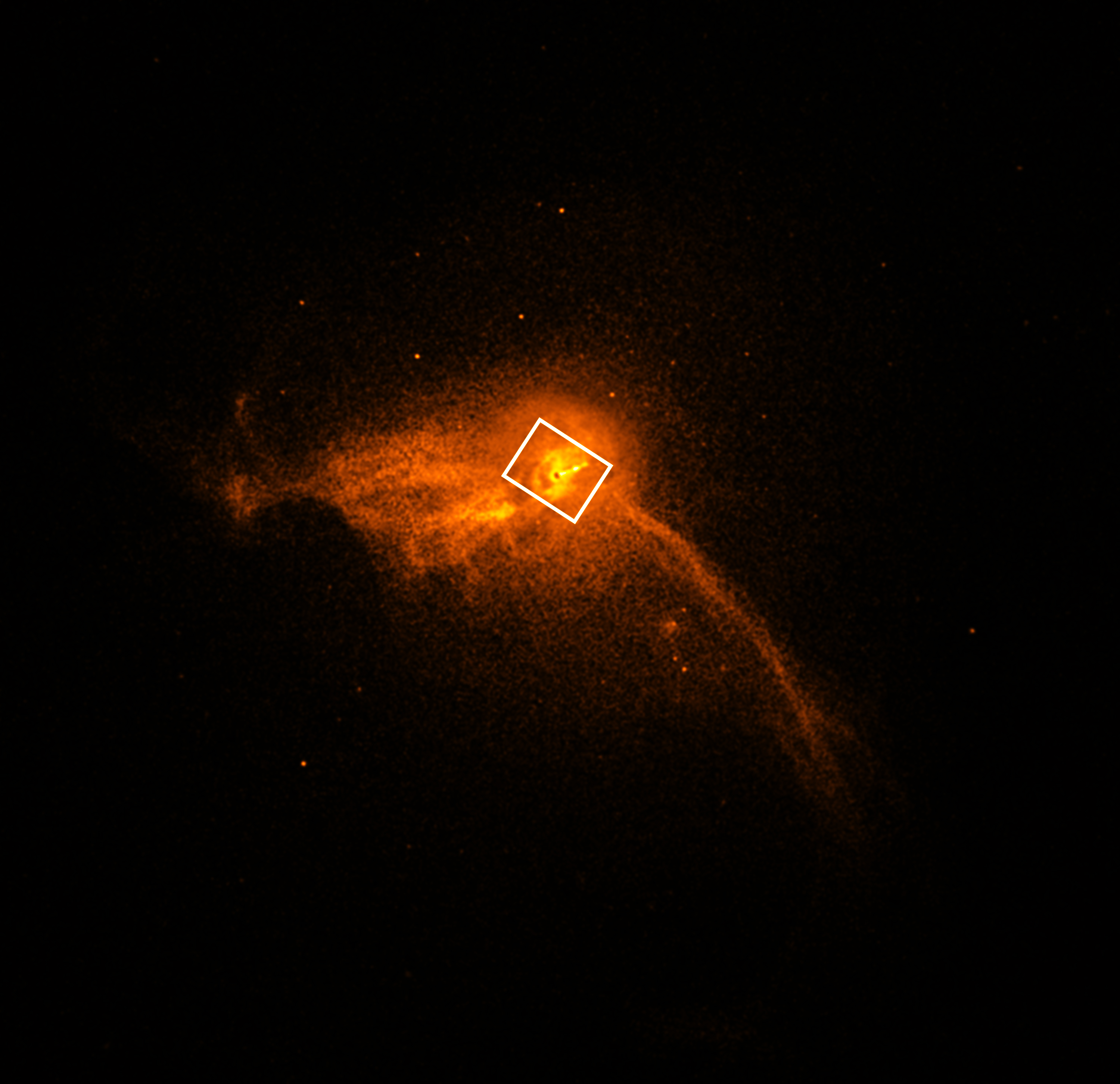 An image showing a smattering of orange stars against the black backdrop of space with a small black circle in the middle and a rectangle identifying the location of the M87 black hole.