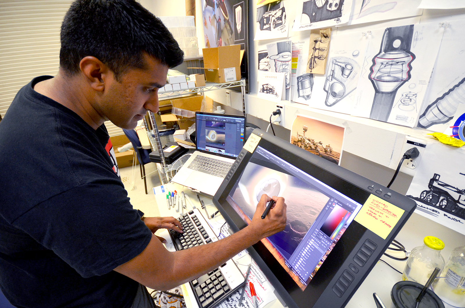 Omar Rehman works on an illustration at JPL