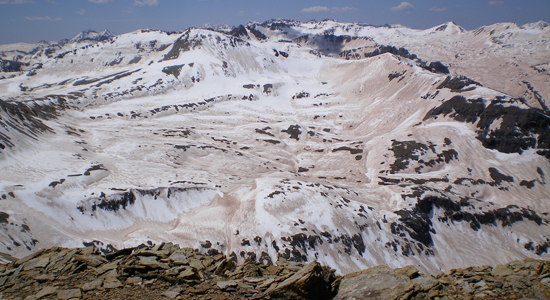 Snow melting on top of a mountainside Snow melting on top of a mountainside