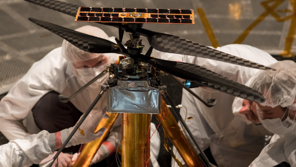 Engineers inspecting Mars helicopter Ingenuity