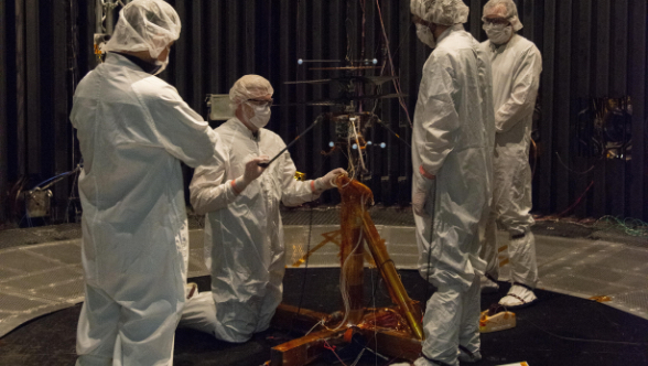 Members of NASA's Mars Helicopter team prepare the flight model for a test in the Space Simulator at NASA's Jet Propulsion Laboratory in Pasadena, California.