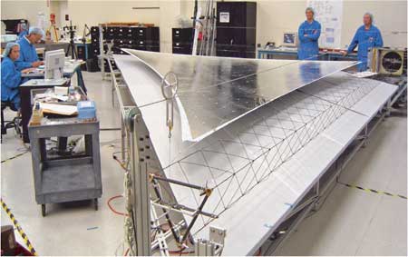 Engineers test solar sail deployment in the lab.