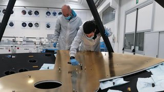 The ASTHROS mirror is composed of nine panels, coated in nickel and gold. Here, engineers attach panels to the mirror's support structure. The panels must be aligned to within 0.0001 inches (2.5 micrometers), or a fraction of the width of a human hair.