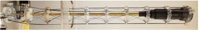 Design, build and test a prototype half-meter boom for deployment of a reflectarray antenna feed from 2U volume.