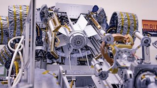 The Multi-Mission Radioisotope Thermoelectric Generator for NASA'S Mars 2020 Perseverance rover is shown during a fit check with the rover at NASA's Kennedy Space Center in Florida on April 16-17, 2020.